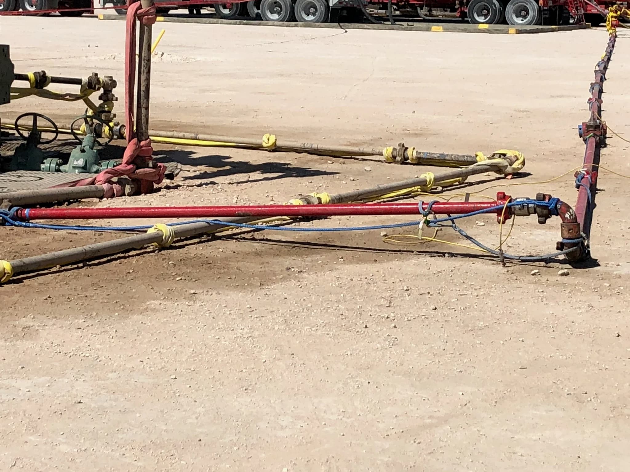 Wellhead piping and flow-iron on a Permian Basin site